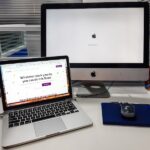 silver iMac near space gray MacBook Pro